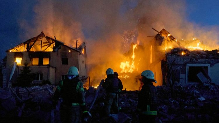 Ukrainian rescuers work to extinguish a fire at the site of an overnight missile strike on private buildings in Kharkiv, northeastern Ukraine, 10 May 2024, amid the Russian invasion. EPA/SERGEY KOZLOV