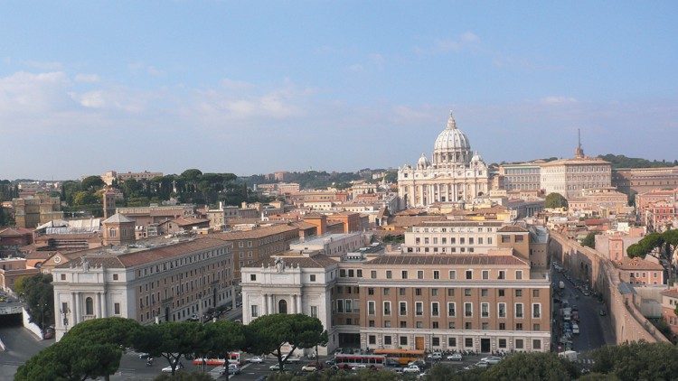 A view of the headquarters of Vatican News with St. Peter's in the background
